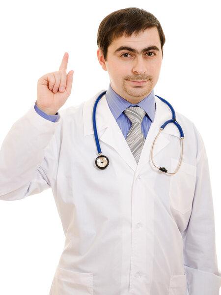 Male doctor points his finger up on a white background.