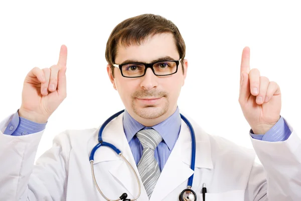 Homme médecin pointe son doigt vers le haut sur un fond blanc . — Photo