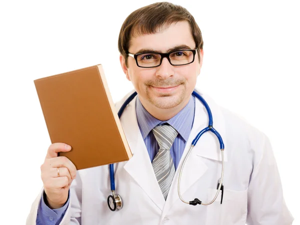O médico diz com um livro sobre um fundo branco . — Fotografia de Stock