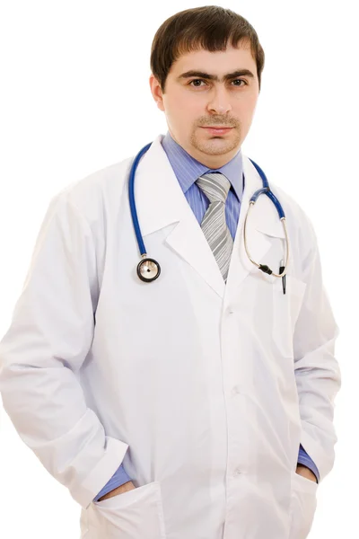Un médico con un estetoscopio sobre un fondo blanco . Imagen de stock