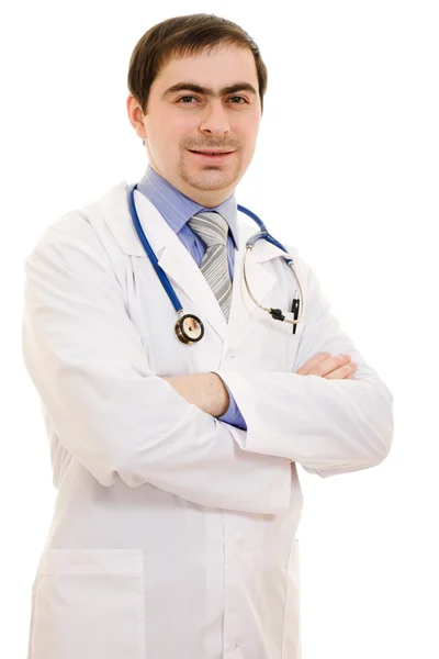 Un médico con un estetoscopio colocó sus manos en un fondo blanco . Fotos de stock