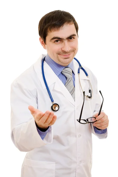 A doctor with a stethoscope and glasses speaks on a white background. Royalty Free Stock Images