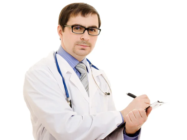 Мужчина врач пишет на таблице документов на белом фоне . Стоковая Картинка