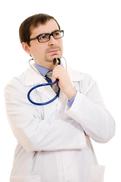 Il dottore pensa in occhiali su uno sfondo bianco . Immagine Stock