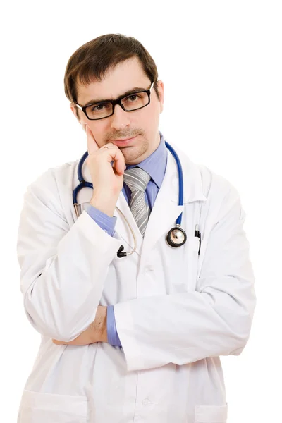 Il dottore pensa in occhiali su uno sfondo bianco . Foto Stock Royalty Free