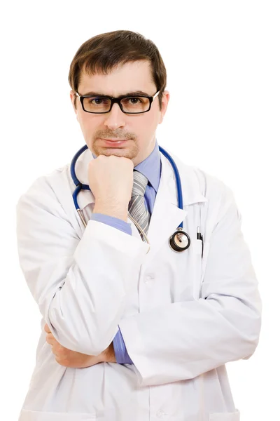 Le médecin pense dans des lunettes sur un fond blanc . Images De Stock Libres De Droits
