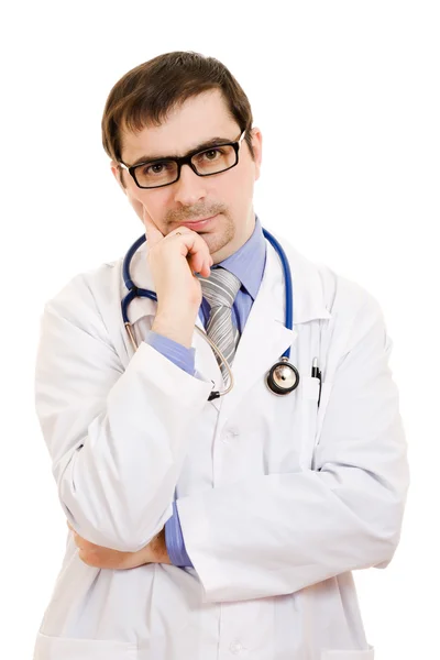 Il dottore pensa in occhiali su uno sfondo bianco . Fotografia Stock