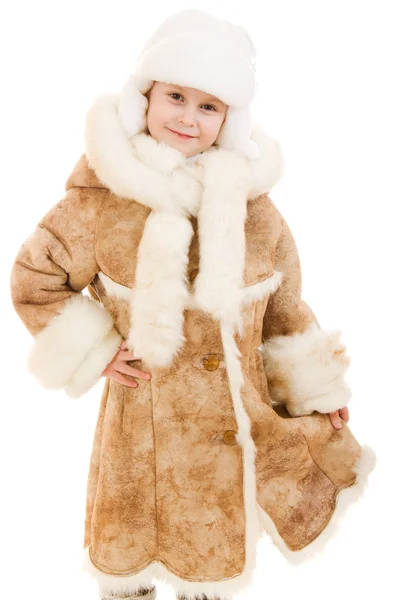 Chica en un abrigo de piel de oveja y sombrero sobre un fondo blanco . —  Fotos de Stock