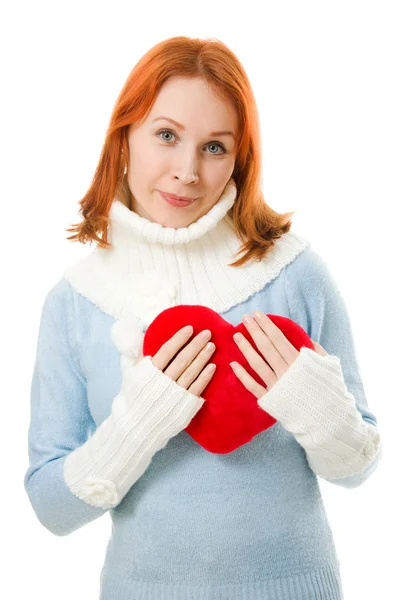 Beautiful girl in warm clothes with a heart — Stock Photo, Image