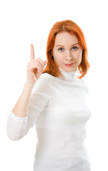 Een mooi meisje met rode haren toont duim omhoog op een witte achtergrond. — Stockfoto