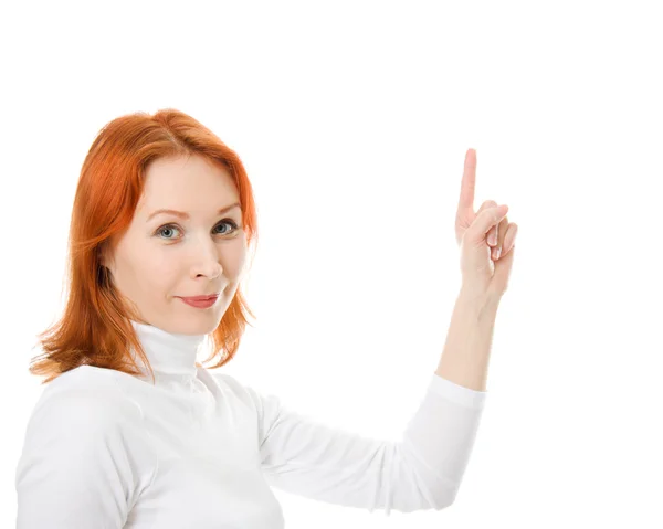 Een mooi meisje met rode haren toont duim omhoog op een witte achtergrond. — Stockfoto
