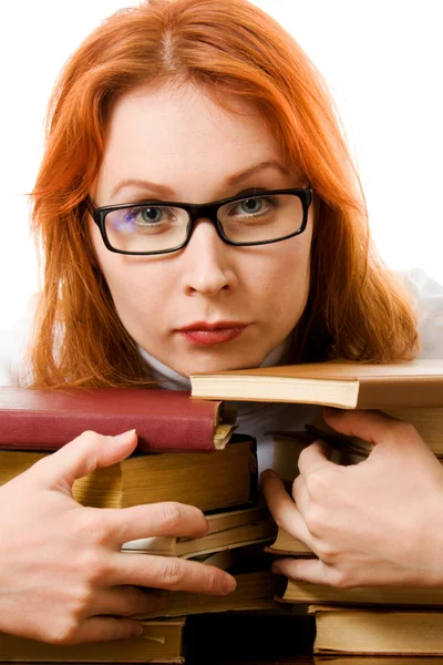 Beautiful red-haired girl in glasses reads book. — Stock Photo, Image