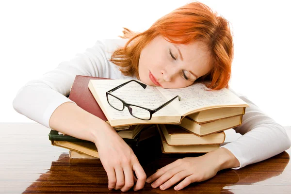 Beautiful red-haired girl in glasses reads book. — Stock Photo, Image