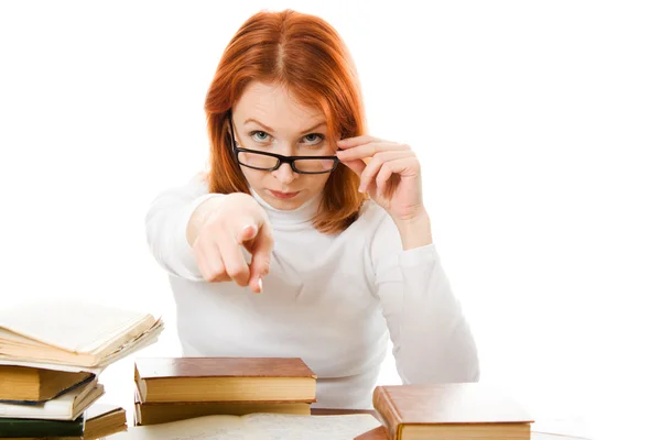 Молодая студентка с книгами в очках — стоковое фото