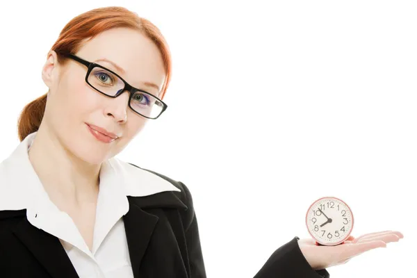 Pretty smiling woman holding a clock — Stock Photo, Image