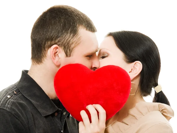 stock image Man and woman kissing with a heart.