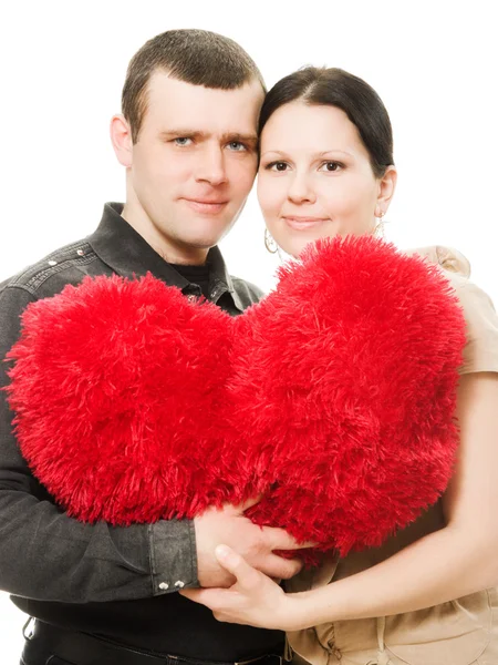 Homem e mulher com um coração nas mãos — Fotografia de Stock