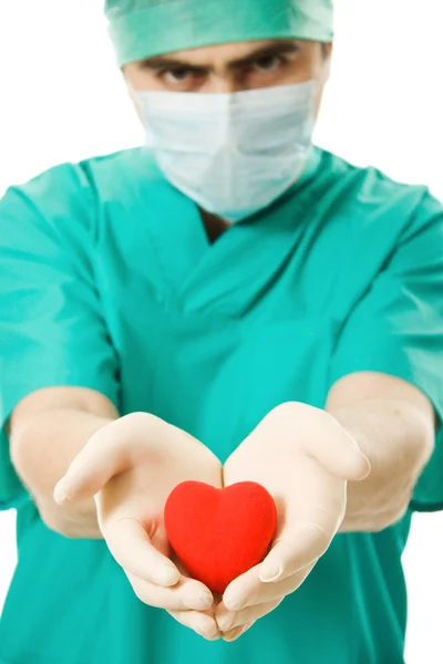 Male doctor with a heart in his hands — Stock Photo, Image