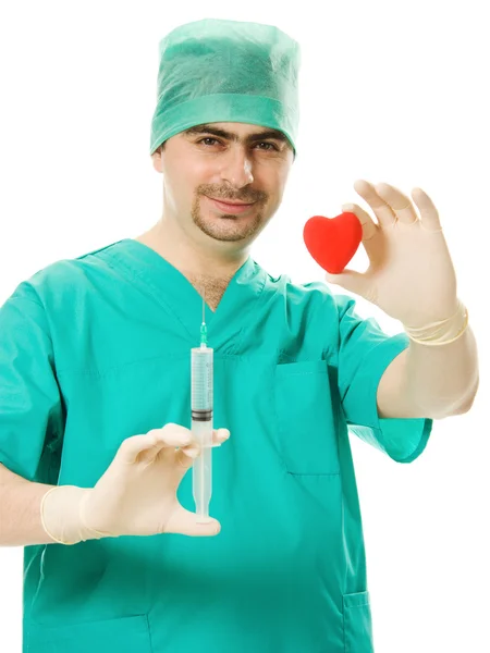 Doutor com coração e seringa na mão — Fotografia de Stock