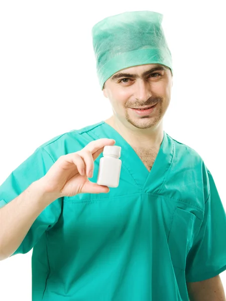 Der Arzt hält ein Gefäß mit Vitaminen auf weißem Hintergrund. — Stockfoto