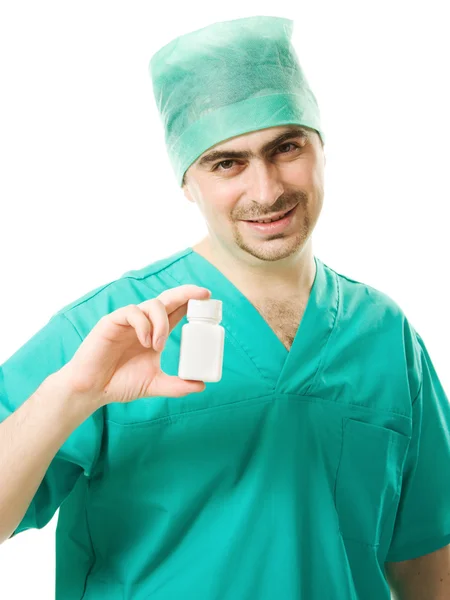 白い背景の上のビタミンのコンテナーを保持している医師男. — ストック写真