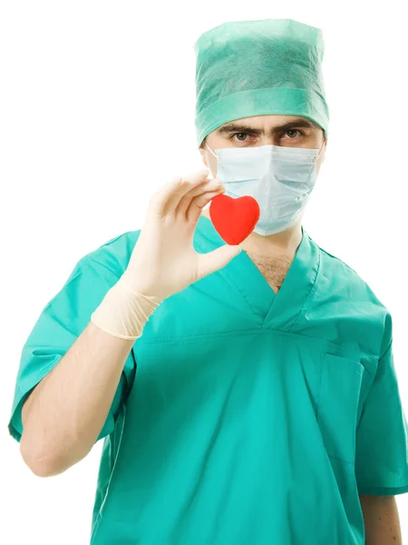 Male doctor with a heart in his hands — Stock Photo, Image