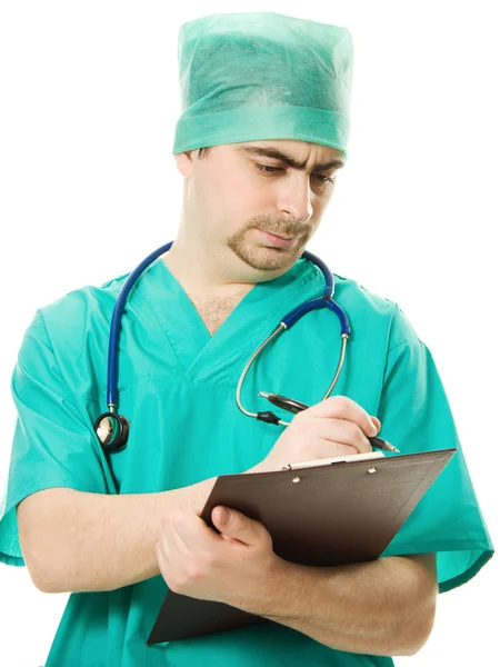 Hombre cirujano escribe en la tableta — Foto de Stock
