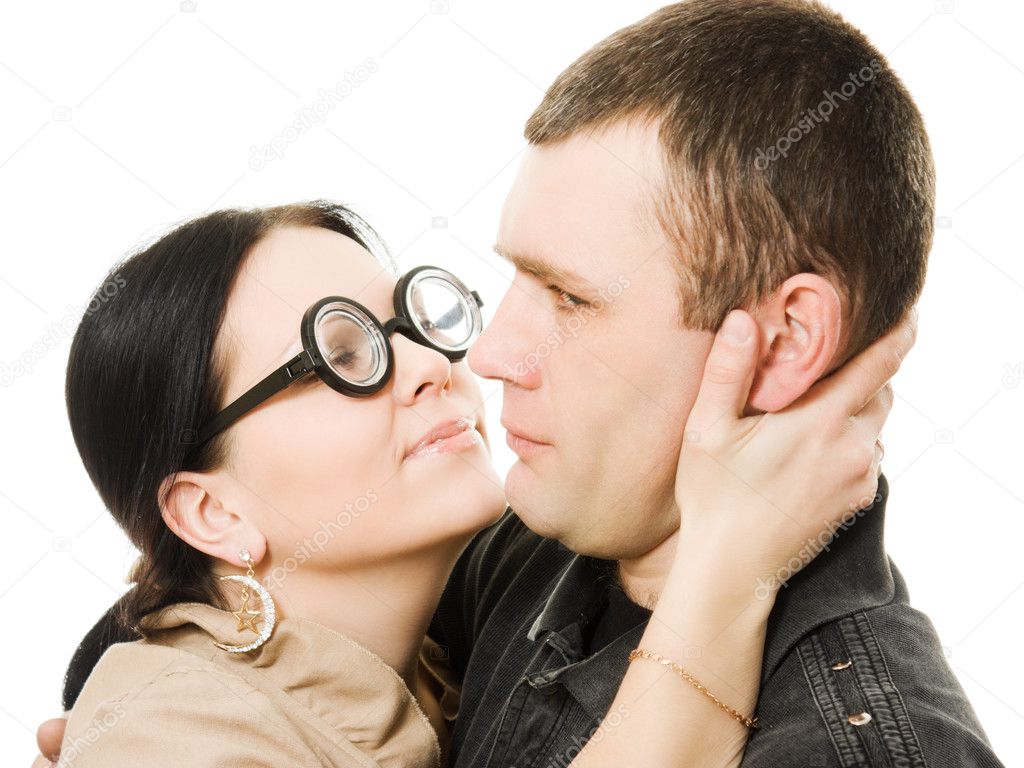 Funny woman in glasses wants to kiss a man Stock Photo by ©khamidulin  9740306