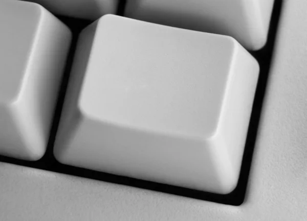 Closeup of empty computer key on keyboard