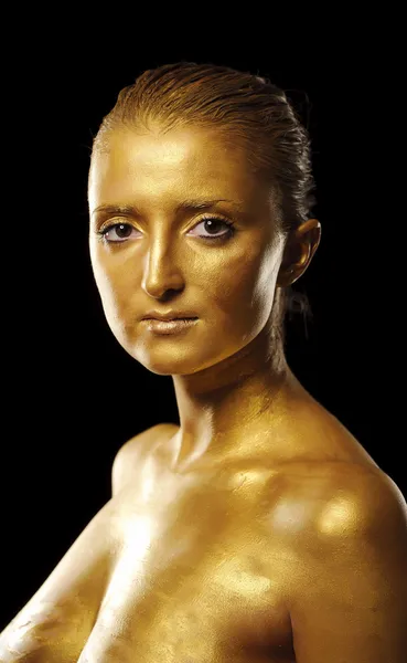 Młoda kobieta z złoty skóry — Zdjęcie stockowe