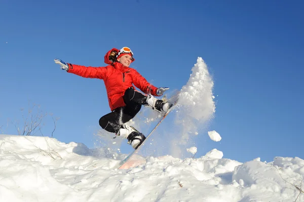 Young woman on snowboard — Stock Photo, Image