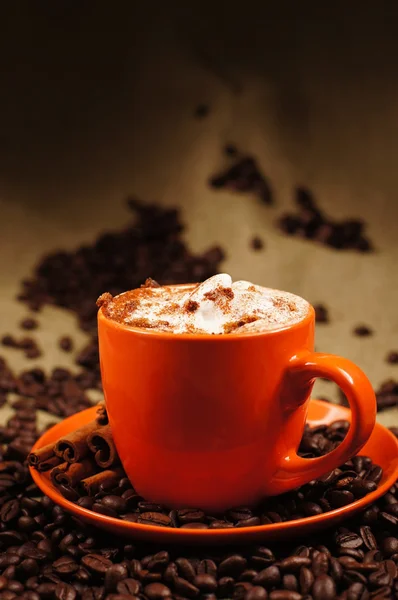 stock image Orange cup with hot cuppuccino