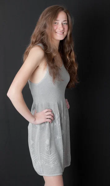 Girl in a gray dress — Stock Photo, Image