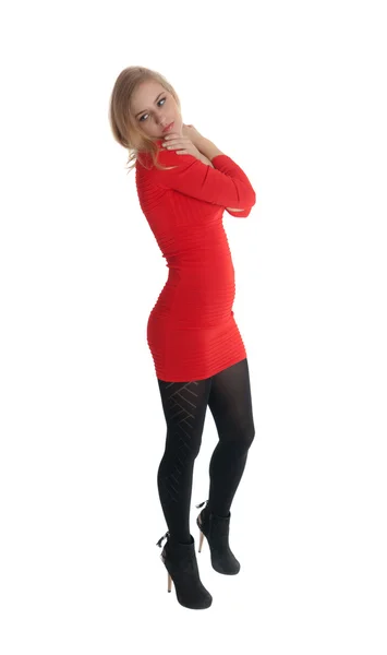 Blonde in een rode jurk — Stockfoto
