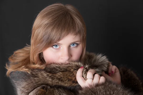 stock image Girl in a fur coat