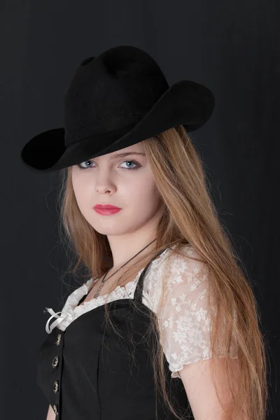 The girl in a black hat — Stock Photo, Image