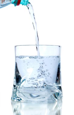 Puring fresh water on glass on white background clipart