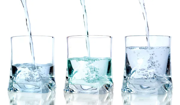 Fresh water pouring in a glass on white background in sequence — Stock Photo, Image