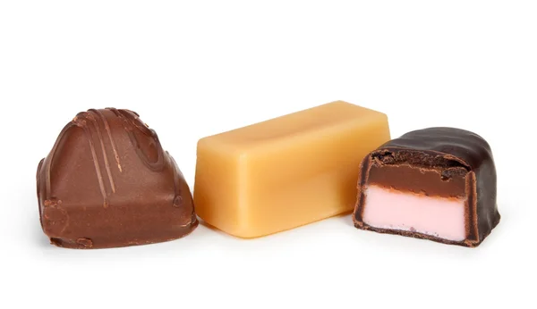 Διαφορετικές candeis σοκολάτας που απομονώνονται σε λευκό — Φωτογραφία Αρχείου