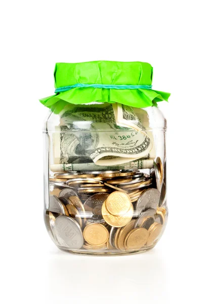 Glas bank för tips med mynt och papper dollarn räkningar — Stockfoto