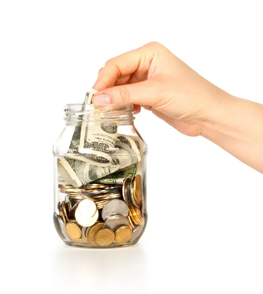 Glas bank voor tips met geld en hand — Stockfoto