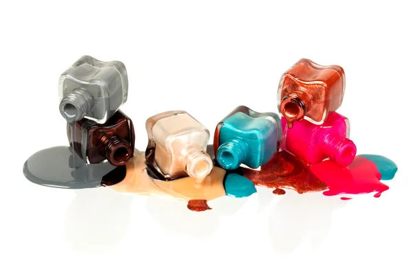 Nail polish dripping from stacked bottles — Stock Photo, Image