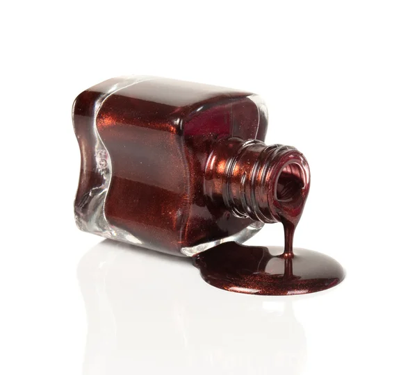 Botella con esmalte de uñas derramado —  Fotos de Stock