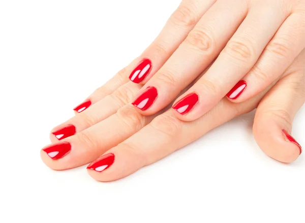 Close up de mãos femininas com manicure vermelho — Fotografia de Stock