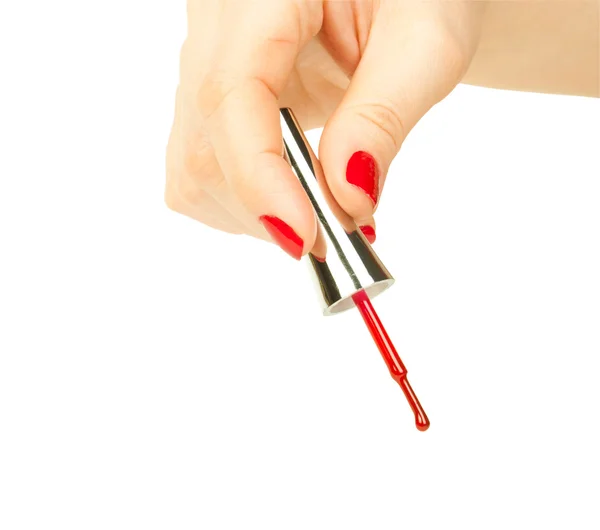 Manikérka použití červený lak na ženské prsty — Stock fotografie