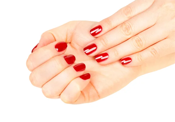 Närbild av kvinnliga händer med rött manikyr — Stockfoto