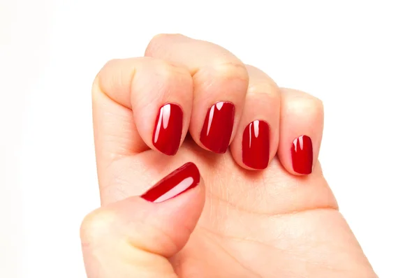 Primer plano de las manos femeninas con manicura roja — Foto de Stock