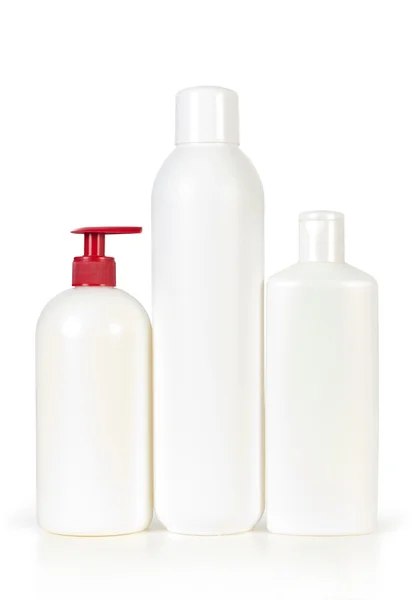 Trzy puste butelki szamponu — Zdjęcie stockowe