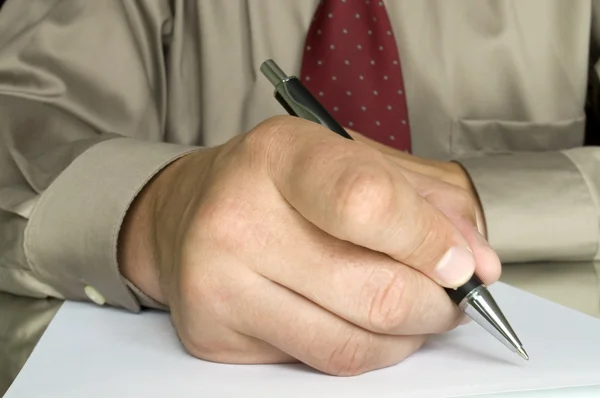 Hand met pen schrijven over het Witboek — Stockfoto