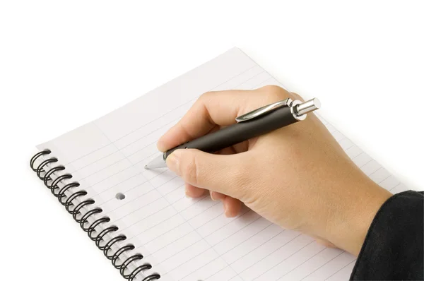 Pen in de hand schrijven op de notebook — Stockfoto